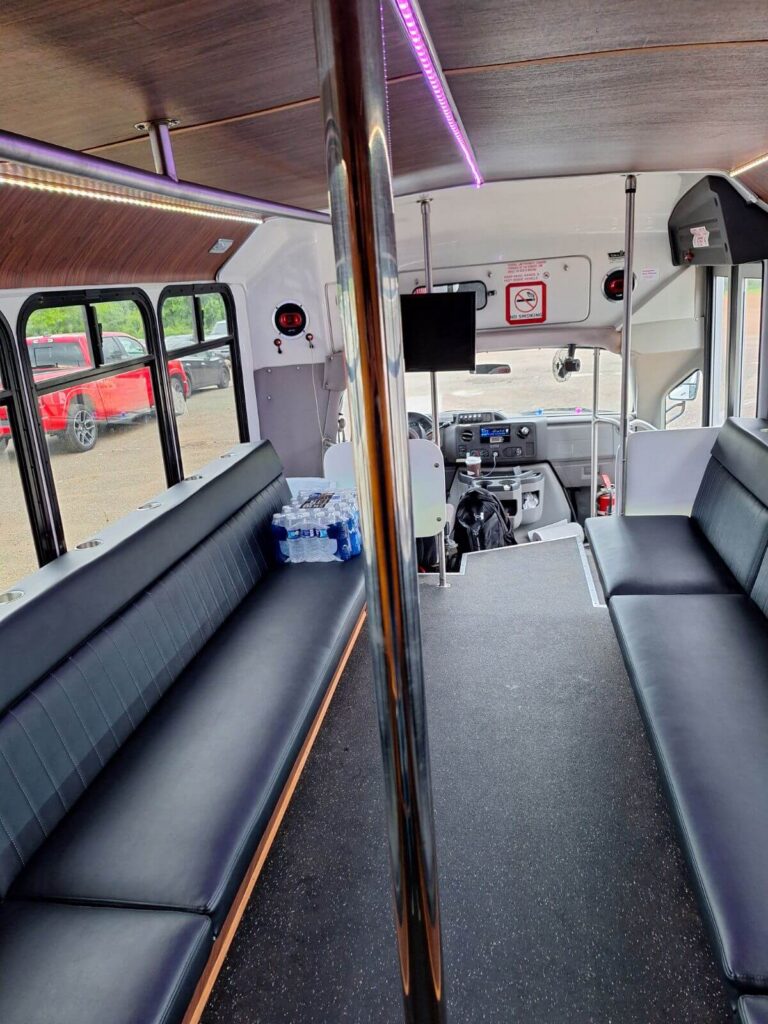 Perfect for a Wisconsin bachelor party or wedding shuttle, this party bus features black benches.